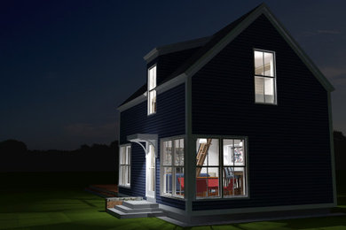 Imagen de fachada de casa azul de estilo de casa de campo pequeña de dos plantas con revestimiento de madera, tejado a dos aguas y tejado de teja de madera