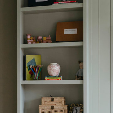 Custom Playroom Built-In Cabinets with TV Wall and Bench Storage