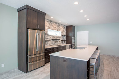 Example of a minimalist kitchen design in Other with quartzite countertops
