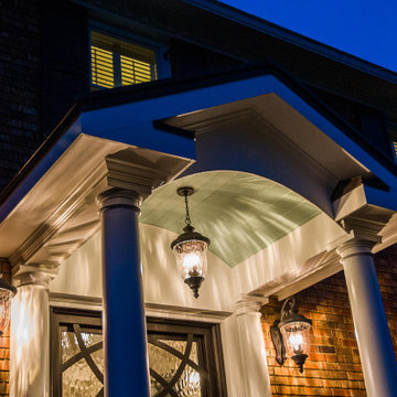 Beautiful evening portico with gable roof and arch facade