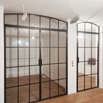 Arched steel doors for the wine cellar