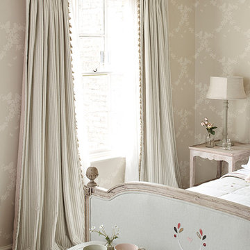 When using a decorative wallpaper, use a plain or striped fabric for the face of