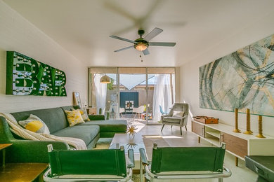 Large 1950s open concept porcelain tile and gray floor living room photo in Phoenix with white walls and no fireplace