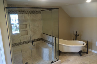 Large elegant master beige tile and porcelain tile porcelain tile and multicolored floor bathroom photo in Other with an undermount sink, dark wood cabinets, granite countertops, a two-piece toilet, beige walls, a hinged shower door and shaker cabinets