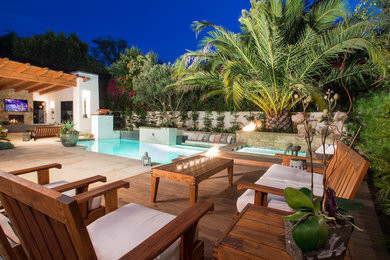 Small trendy backyard concrete and rectangular pool photo in Orange County