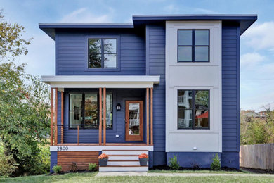 Modelo de fachada de casa azul minimalista grande de dos plantas con revestimiento de aglomerado de cemento, tejado plano y tablilla