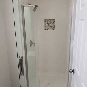 Two Bathroom Renovations and Custom Closet Shelving with Custom Tile Showers