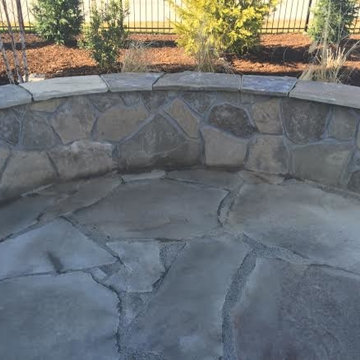 Natural Stone Patio with a knee wall