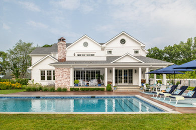 Example of a large beach style pool design in New York