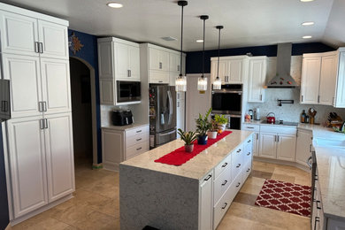 Mid-sized transitional eat-in kitchen photo in Austin with shaker cabinets, white cabinets, quartz countertops, quartz backsplash and an island