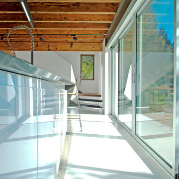 Glass Corridor Connecting Interior to Landscape