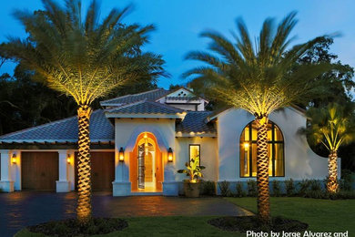 Inspiration for a mid-sized mediterranean home design remodel in Tampa