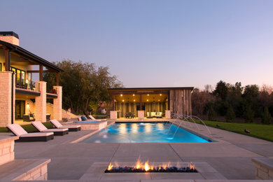 Inspiration for a modern backyard concrete and rectangular pool remodel in Denver