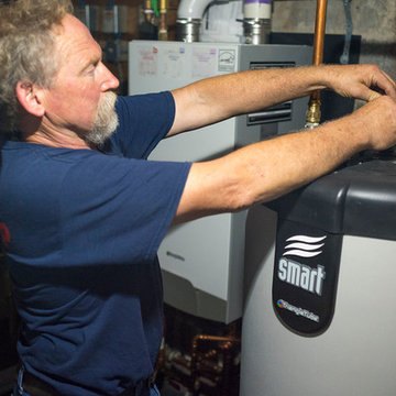 Air Group Expert Technician Performing Maintenance on a Water Heater