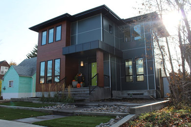 Inspiration for a mid-sized modern gray two-story concrete fiberboard exterior home remodel in Edmonton