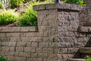 Inspiration for a mid-sized contemporary hillside retaining wall landscape in Charlotte.