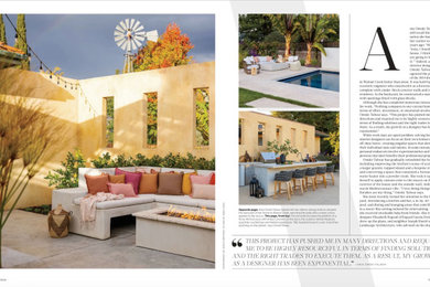 Inspiration for a large mediterranean courtyard concrete patio remodel in San Francisco with a fire pit and no cover