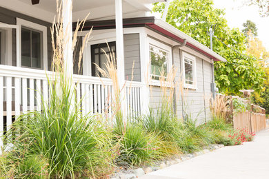 Design ideas for a mid-sized traditional drought-tolerant and full sun front yard garden path in Other with decking.
