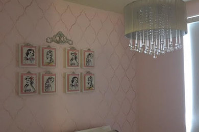 Inspiration for a medium sized modern teen’s room for girls in Miami with pink walls.