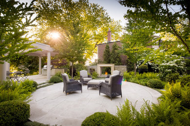 Design ideas for a transitional garden in Toronto with a fire feature.