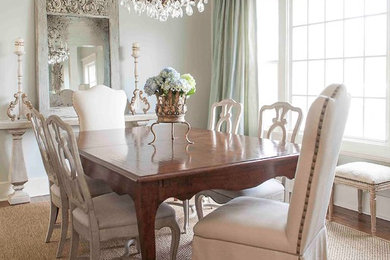 Ornate dark wood floor dining room photo in Little Rock with gray walls