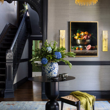 Vaulted Entry with Staircase & Gold Fringe Chandeliers