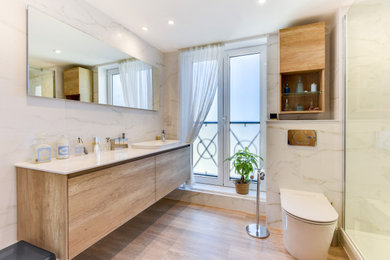 Photo of a small contemporary grey and white shower room bathroom in Sussex with flat-panel cabinets, brown cabinets, a walk-in shower, a one-piece toilet, white tiles, ceramic tiles, white walls, vinyl flooring, a built-in sink, quartz worktops, brown floors, an open shower, white worktops, a shower bench, a single sink and a floating vanity unit.