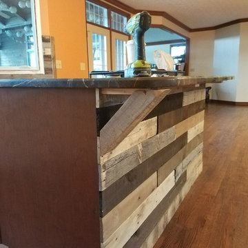 Custom Barnwood backsplash, kitchen accents, door and lighiting
