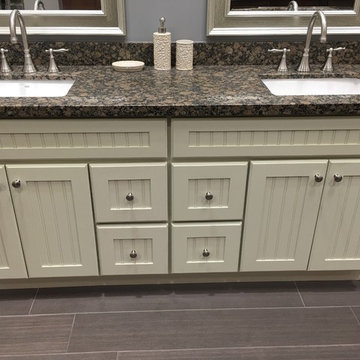 Off white country cottage French style with granite counter top and ceramic unde