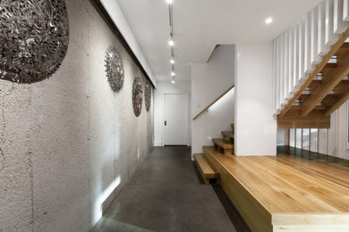 Example of a mid-sized danish wooden l-shaped open and wood railing staircase design in Indianapolis