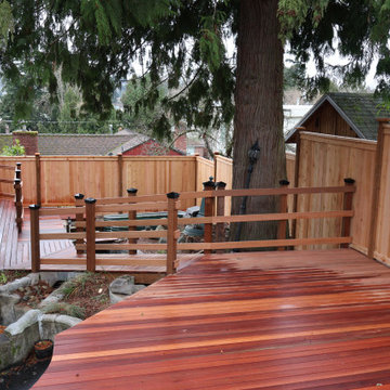 Custom Mahogany Deck and Cedar Fence on Sloped Yard
