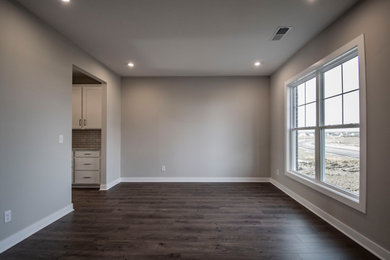 Enclosed dining room - large craftsman brown floor enclosed dining room idea in Louisville with gray walls