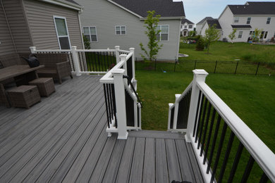 Example of a small classic backyard deck design with no cover