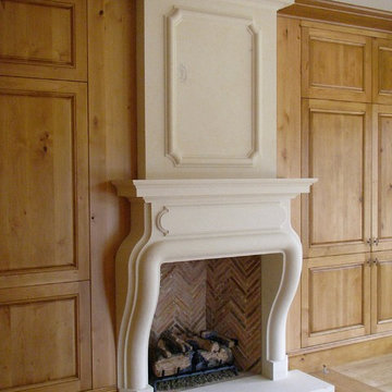 French style hand-carved stone fireplace.