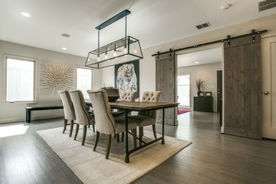 Design ideas for a country separate dining room in Dallas with grey walls, dark hardwood floors and no fireplace.