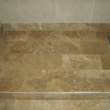 Travertine and porcelain shower with linear drain (before glass installation)