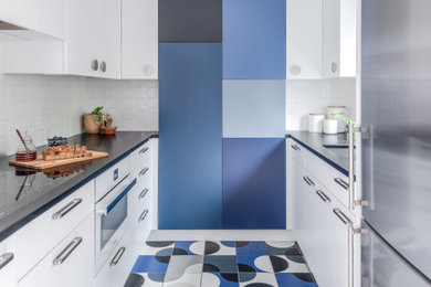 Enclosed kitchen - small modern u-shaped enclosed kitchen idea in DC Metro