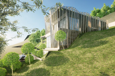 Cette image montre une façade de maison beige design en bois de taille moyenne et à deux étages et plus avec un toit plat.