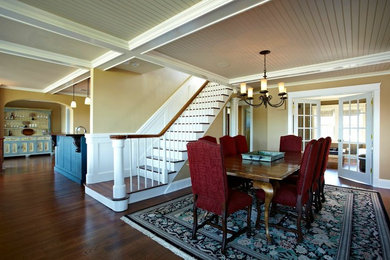 Dining room - mid-sized transitional dark wood floor dining room idea in New York with beige walls