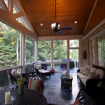 Gable screen porch with tile floor and spiral staircase