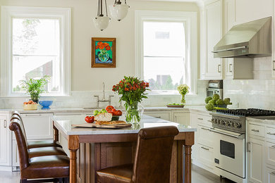 Elegant kitchen photo in Boston with subway tile backsplash