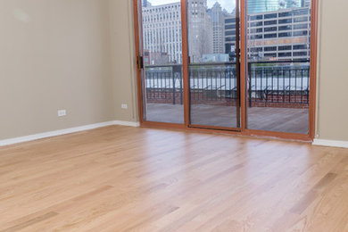 Small minimalist master light wood floor and beige floor bedroom photo in Chicago with beige walls and no fireplace