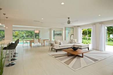 Living room - mid-sized contemporary open concept and formal porcelain tile living room idea in Miami with white walls and a wall-mounted tv