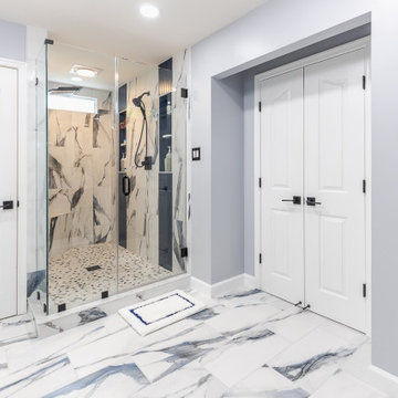Bathroom remodeling in Columbia, MD with double vanity & marble bathtub