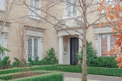 Inspiration for a large timeless beige two-story brick exterior home remodel in Toronto with a mixed material roof