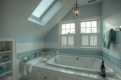 Bathroom - coastal blue tile bathroom idea in Boston with a hot tub and blue walls