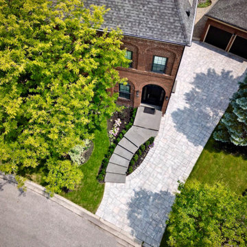 Aerial View of Curved Granite Steps and Large-Format Stone Driveway