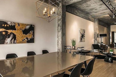 Inspiration for a large industrial open plan dining in Ottawa with white walls, light hardwood floors, no fireplace and brown floor.