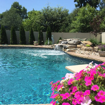 Forks Township custom pool with sunshelf & rock waterfall