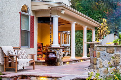 Patio kitchen - mid-sized traditional backyard stone patio kitchen idea in Philadelphia with a roof extension